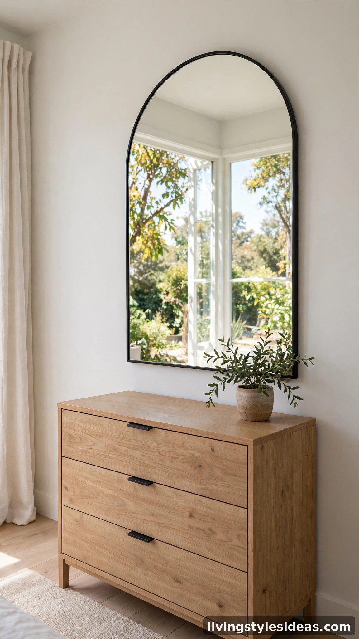 Large decorative mirror as statement wall art in a studio apartment